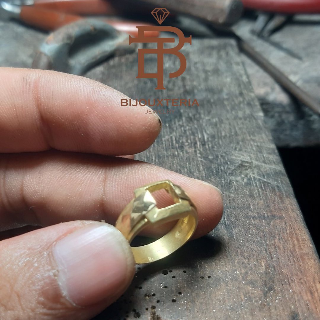 Men's gold ring featuring an oval-cut gemstone and a bezel-set green sapphire pendant Sold individually