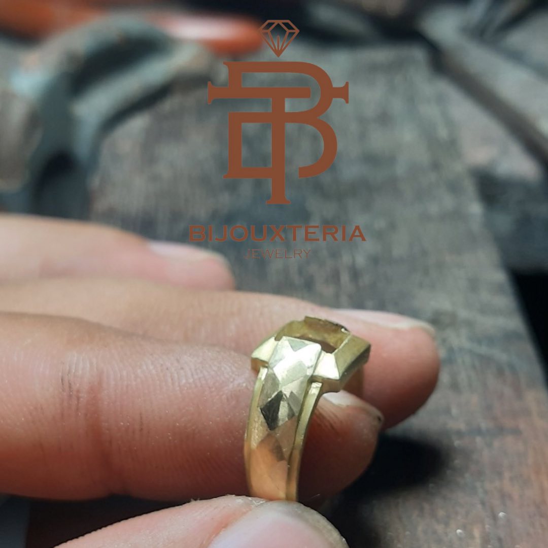 Men's gold ring featuring an oval-cut gemstone and a bezel-set green sapphire pendant Sold individually