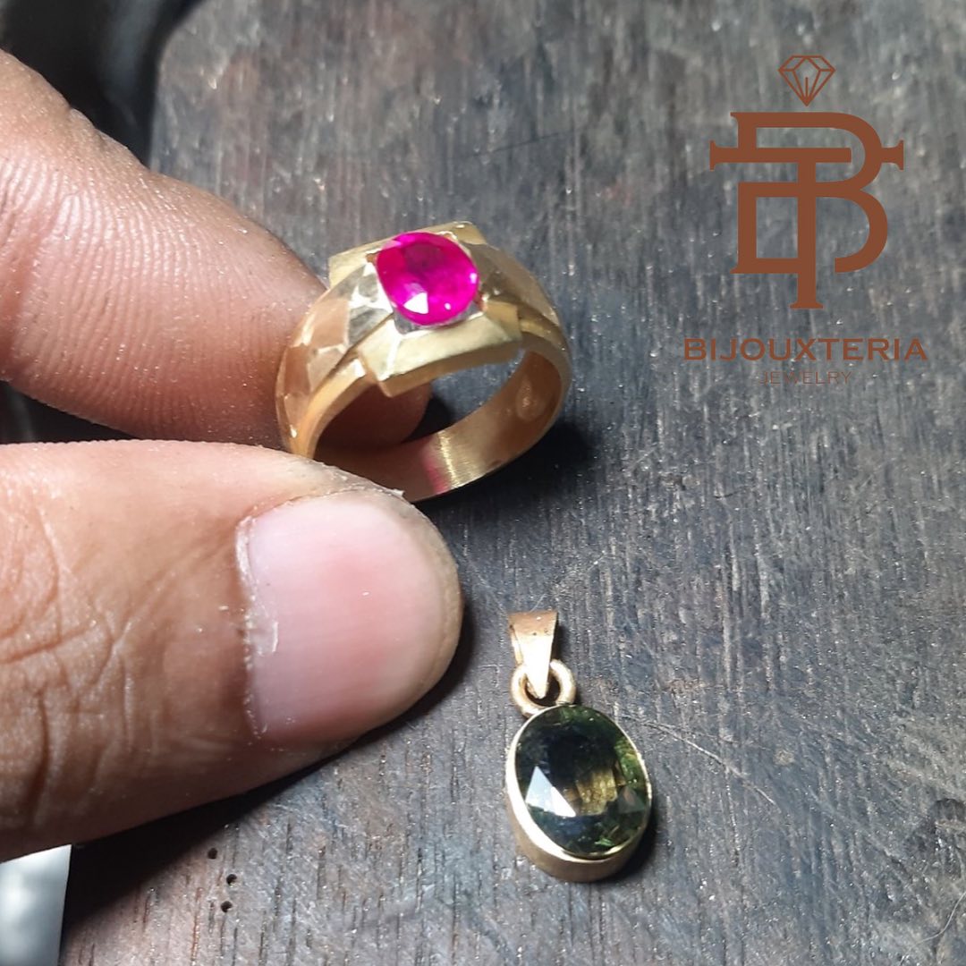 Men's gold ring featuring an oval-cut gemstone and a bezel-set green sapphire pendant Sold individually