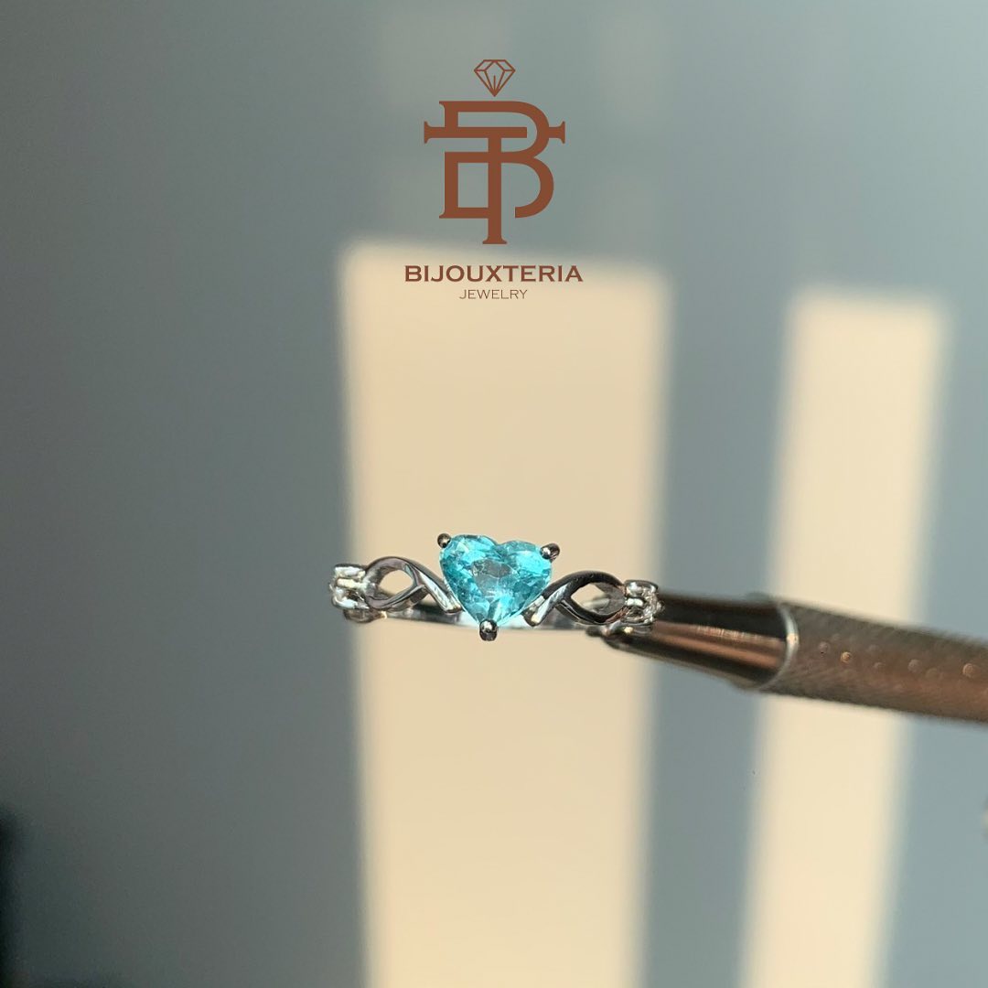 Elegant Slender Shank Ring Featuring Heart Brilliant Cut Teal Blue Gemstone and Infinity Accents